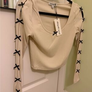 Pretty Garbage Cream Crop Top with Black Bow Details